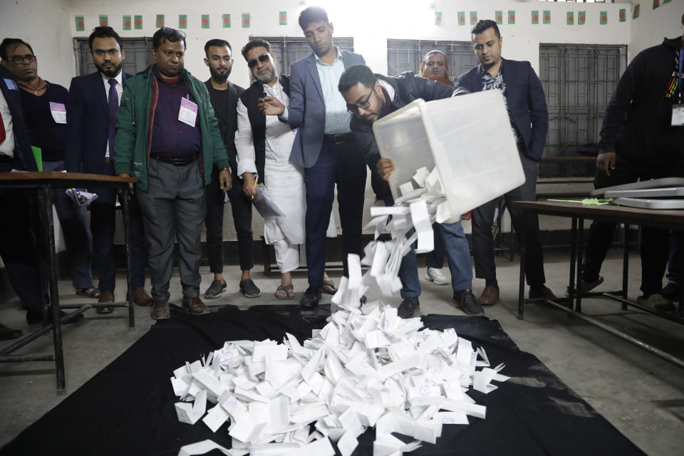 Officials prepare to count votes of parliamentary election in Dhaka, Bangladesh, Sunday, Jan 7, 2024. Voters in Bangladesh cast ballots Sunday in the election fraught with violence and a boycott from the main opposition party, paving the way for Prime Minister Sheikh Hasina and her Awami League to seize a fourth consecutive term. (AP Photo/Mahmud Hossain Opu)