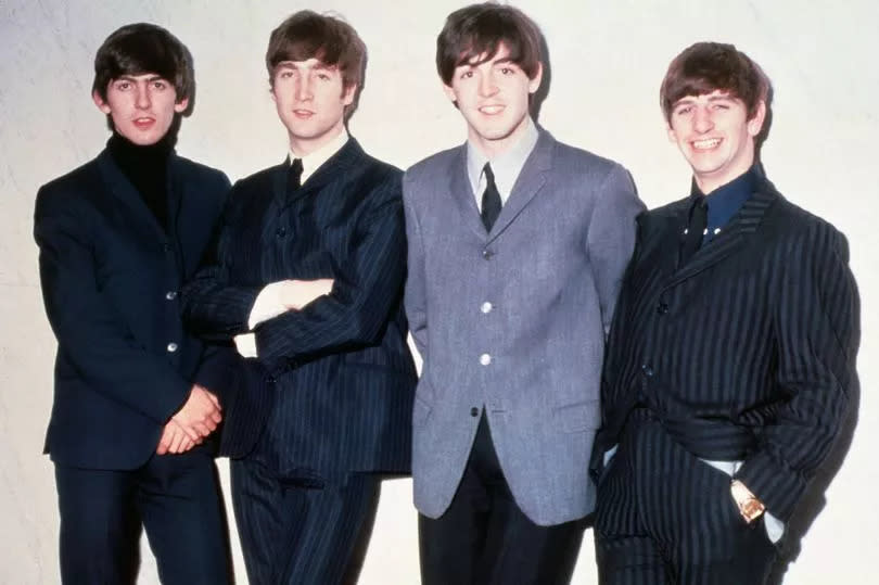 The Beatles posing together. From left to right: musicians George Harrison, John Lennon, Paul McCartney and Ringo Starr, circa 1965.