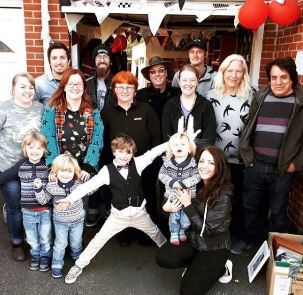 Jacob poses with his family and friends who are helping with the campaign to help the homeless