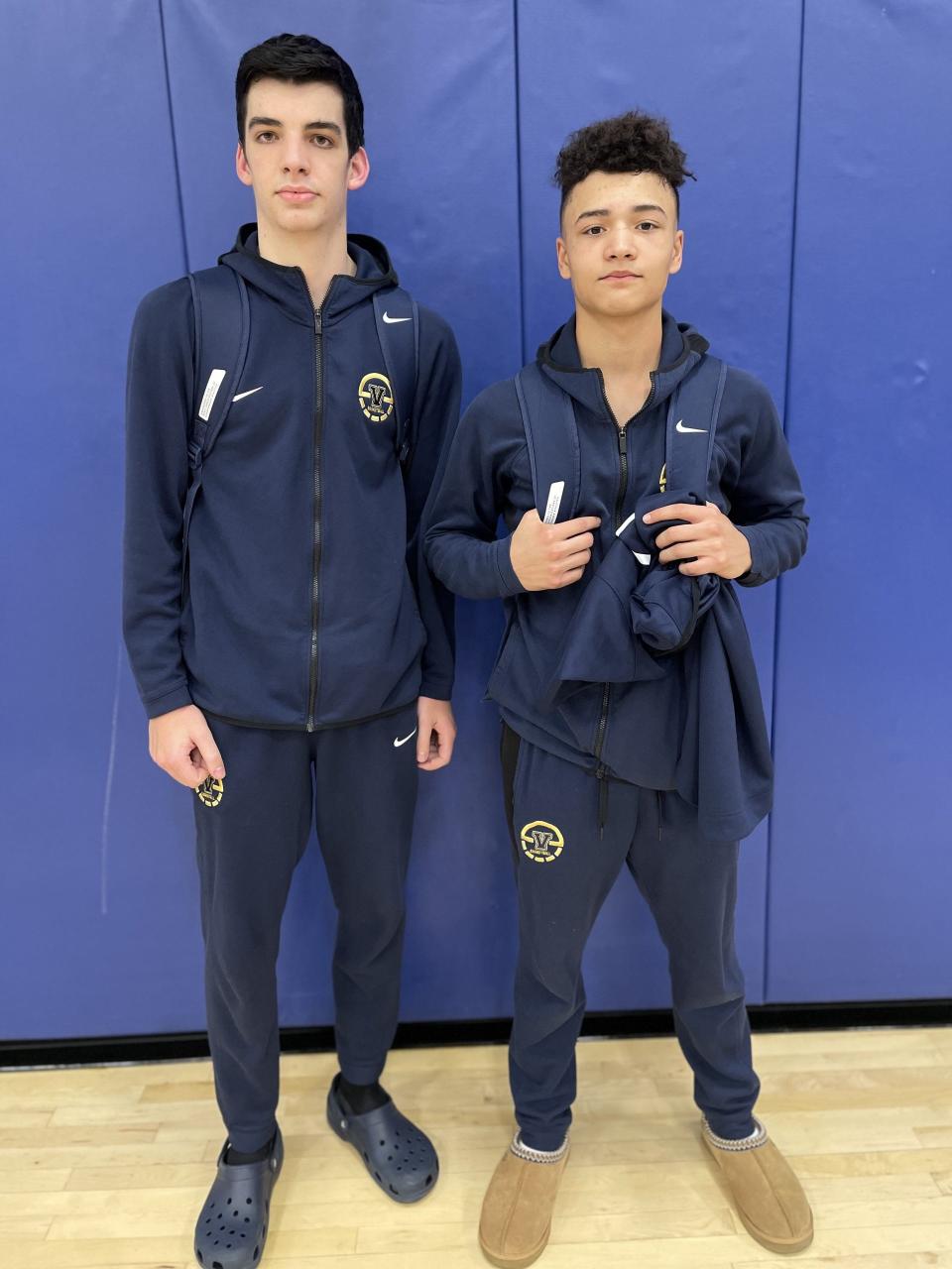 Victor basketball players Owen Dake, left, and RJ Johnson after a 68-64 win at Irondequoit on Jan. 5.