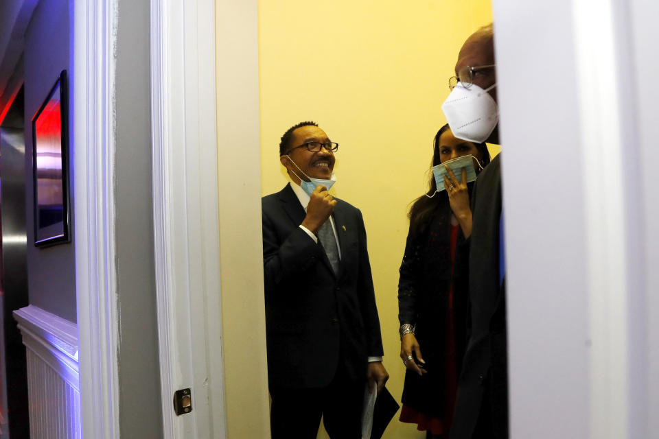 Democrat Kweisi Mfume, left, reacts before entering an election night news conference at his campaign headquarters after he won the 7th Congressional District special election, Tuesday, April 28, 2020, in Baltimore. Mfume defeated Republican Kimberly Klacik to finish the term of the late Rep. Elijah Cummings, retaking a Maryland congressional seat Mfume held for five terms before leaving to lead the NAACP. All voters in the 7th Congressional District were strongly urged to vote by mail in an unprecedented election dramatically reshaped by the coronavirus pandemic. (AP Photo/Julio Cortez)