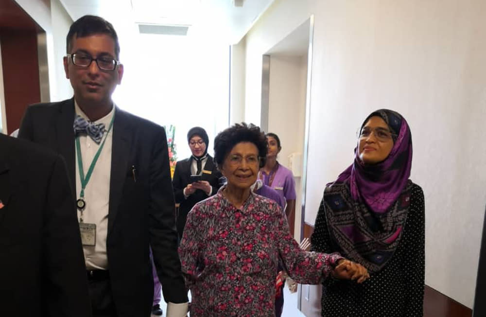 Tun Dr Siti Hasmah Mohamad Ali leaving the Prince Court Medical Centre accompanied by hospital staff today. — Picture courtesy of Prime Minister’s Office