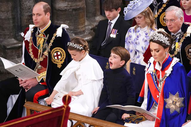 YUI MOK/POOL/AFP via Getty Prince William, Princess Charlotte, Prince Louis and Kate Middleton at the coronation in May 2023