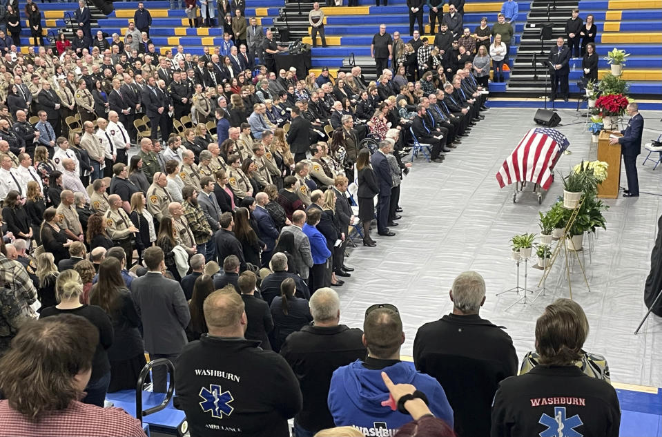 A large crowd gathered in the Beulah High School gym on Wednesday to say goodbye to slain Mercer County Deputy Paul Martin, Wednesday, Dec. 13, 2023, in Beulah, N.D. The North Dakota sheriff's deputy was killed last week in a crash involving U.S. Sen. Kevin Cramer's adult son, who was fleeing police during a mental health crisis. Deputy Martin, 53, was a married father of three and an 18-year veteran of the Mercer County Sheriff’s Office. (Tom Stromme/The Bismarck Tribune via AP)