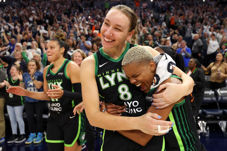 MINNEAPOLIS, MINNESOTA - OCTOBER 08: Alanna Smith #8 and Courtney Williams #10 of the Minnesota Lynx celebrate their win against the Connecticut Sun after game five of the semifinals during the WNBA Playoffs at Target Center on October 08, 2024 in Minneapolis, Minnesota. The Lynx defeated the Sun 88-77. NOTE TO USER: User expressly acknowledges and agrees that by downloading and/or using this photograph, User is agreeing to the terms and conditions of the Getty Images License Agreement. (Photo by David Berding/Getty Images)