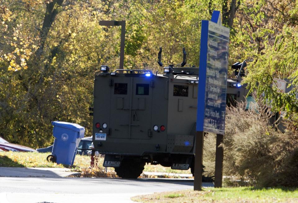 A law enforcement vehicle is seen near Central Connecticut State University while it is in lockdown in New Britain, Connecticut November 4, 2013. A person has been taken into custody at Central Connecticut State University on Monday after officials locked down the campus when a suspicious person, possibly armed, was spotted, said New Britain Mayor Tim O'Brien. Citing students, local media said police had searched for a person who appeared to be carrying a gun and what looked like a sword. (REUTERS/Michelle McLoughlin)