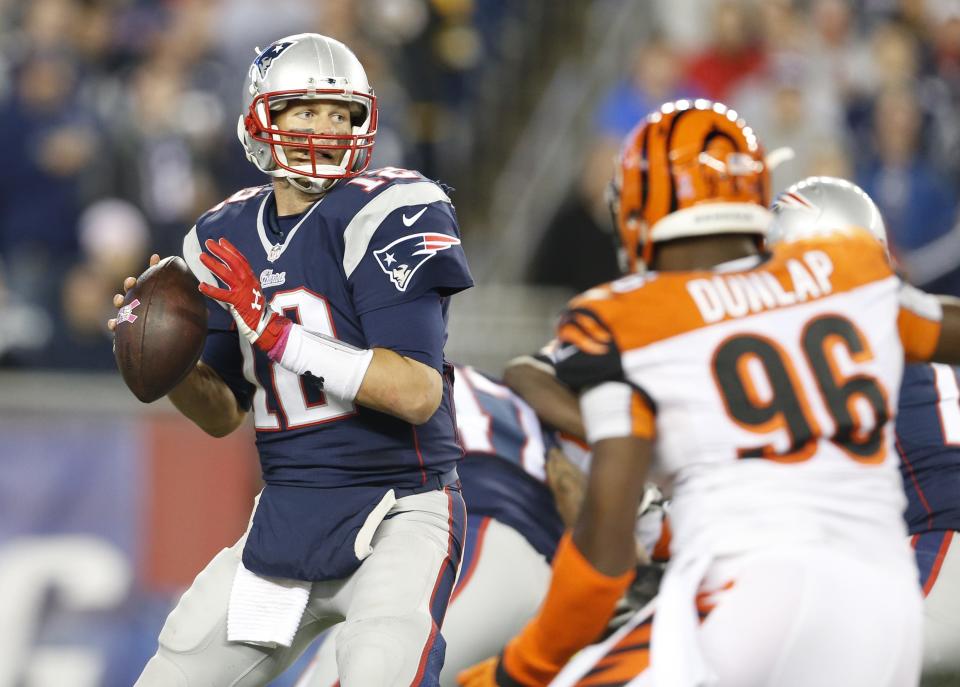 New England Patriots quarterback Tom Brady (12) throws against the Cincinnati Bengals during the third quarter of their game played at Gillette Stadium in Foxborough, Massachusetts Sunday, Oct. 5, 2014.