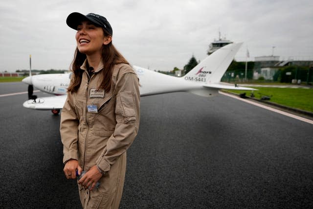 Belgian-British teenager Zara Rutherford speaks on the tarmac in front of her Shark Ultralight plane prior to take-off at the Kortrijk-Wevelgem airfield in Wevelgem, Belgium 