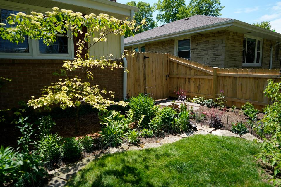 Paul Berens and T.j. Kester's front yard in South Milwaukee includes newer flowerbeds and landscaping.