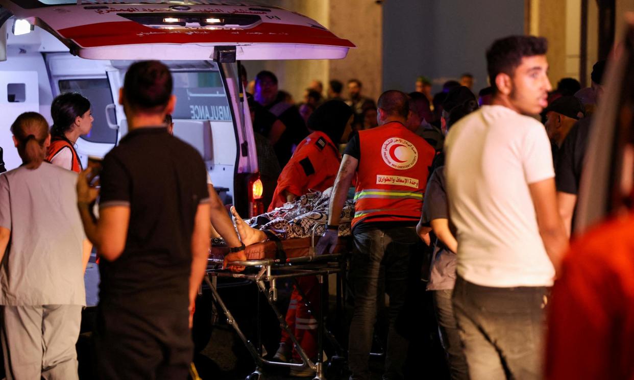 <span>A person is carried outside American University of Beirut Medical Center, including Hezbollah fighters and medics, were wounded and killed when the pagers they use to communicate exploded across Lebanon.</span><span>Photograph: Mohamed Azakir/Reuters</span>