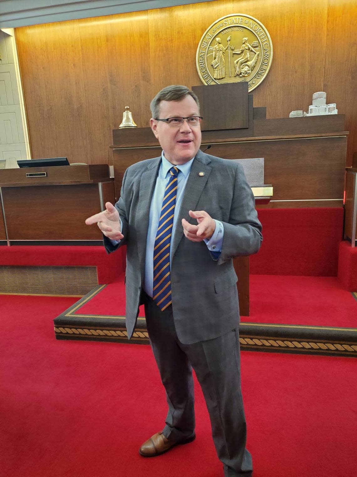 N.C. House Speaker Tim Moore, a Kings Mountain Republican, talks to reporters on the House floor on Aug. 23, 2022 in Raleigh.