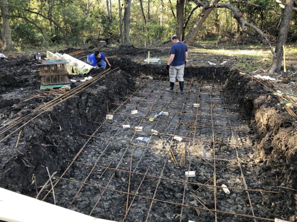 Setting up the foundations for the structure.