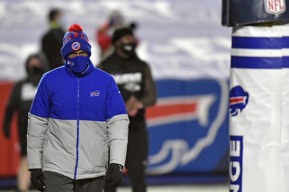 Buffalo Bills Defensive Coordinator Leslie Frazier walks the field before an NFL divisional round football game against the Baltimore Ravens Saturday, Jan. 16, 2021, in Orchard Park, N.Y. All four defensive coordinators who will be trying to shut down high-powered offenses in the NFL playoffs this weekend have been head coaches before, providing valuable experience in the conference championships.(AP Photo/Adrian Kraus)