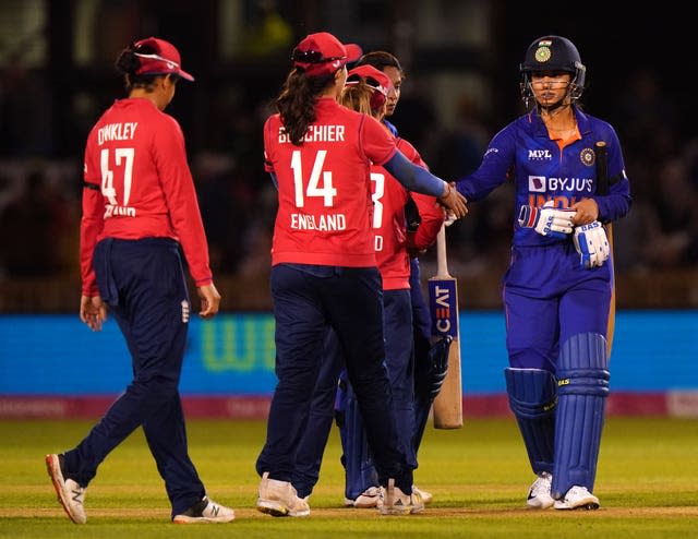 Smriti Mandhana, right, is congratulated after leading India to victory