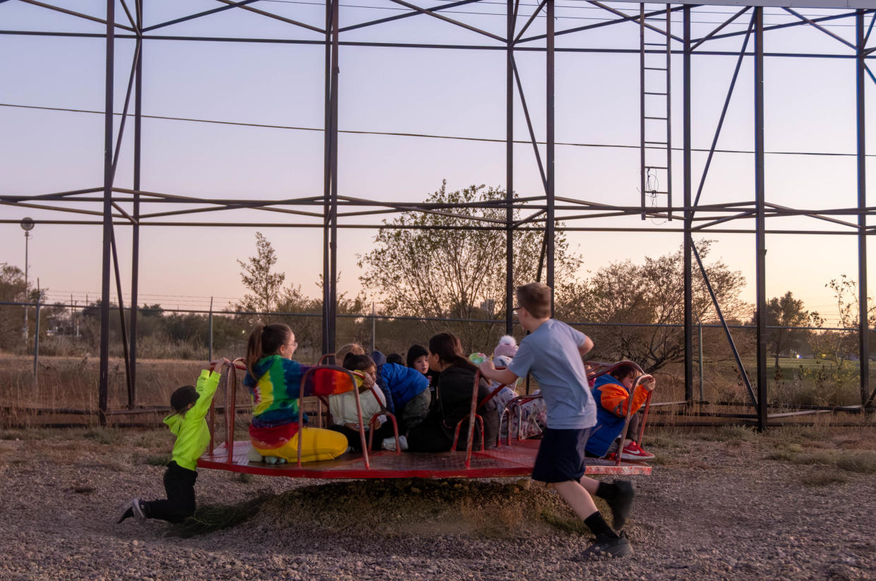 Kids enjoy their final rides Friday night at the Tascosa Drive-in's final show in Amarillo.