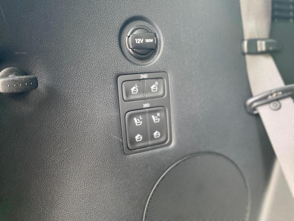 The control buttons that fold the second and third-row seats on a Hyundai Palisade SUV.