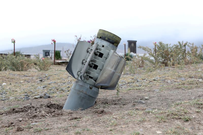 FILE PHOTO: The remains of a rocket shell are seen near a graveyard at the town of Ivanyan (Khojaly) in the breakaway region of Nagorno-Karabakh