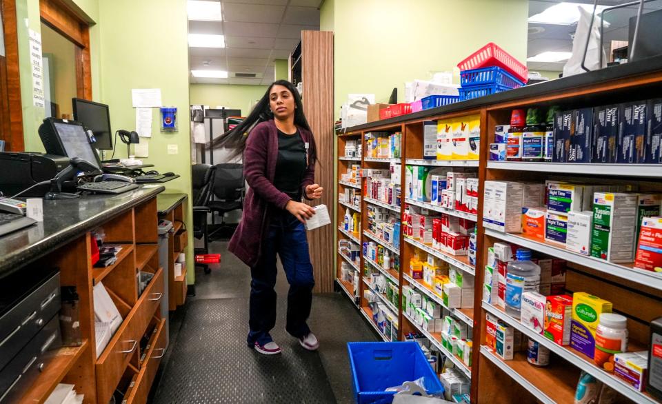 Technician Desiree Guzman filling orders at LIfespan's in-house pharmacy.