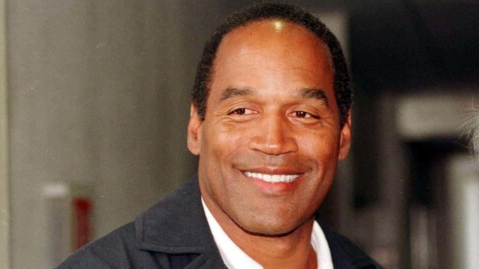 OJ Simpson seen smiling and looking off-camera