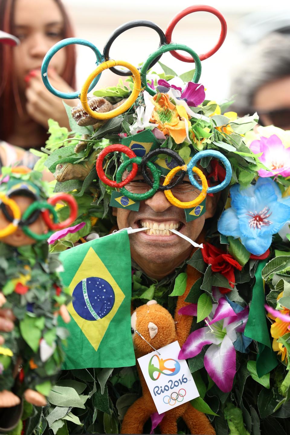 A fan poses before the start of the Women's road cycling race at the Rio 2016 Olympic Games at Fort Copacabana in Rio de Janeiro on August 7, 2016.