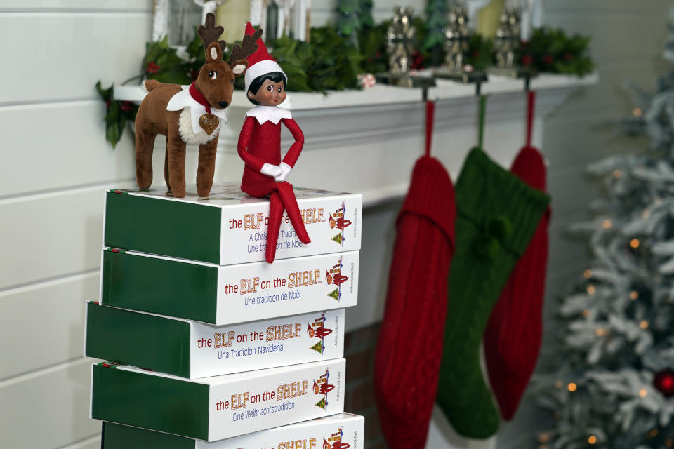 Elf on the Shelf figures are displayed at the company's studio Thursday, Aug. 27, 2020, in Atlanta. Thousands of suppliers routinely rely on credit insurance to cover potential losses if any of the retailers they work with can’t pay for the goods they’ve ordered. But now insurers are scaling back on coverage because they are unwilling to take a chance on retailers that are struggling to survive during the pandemic. Christa Pitts, founder and co-CEO of The Lumistella Company, which produces toys, books and other products under the Elf on the Shelf and Elf Pets brands, says her retail orders were covered 100% before the pandemic. Now, only 50% are covered, forcing her to rethink who she will sell to. (AP Photo/John Bazemore)