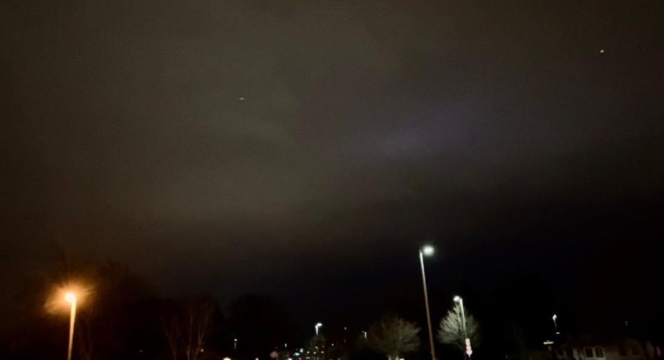 Chris Nowak of Mukwonago took a video of this blue-ish/purple hue in the sky (located to the center right of the image). About 10 seconds later, a white light (that can be seen toward the left of the hue) emanated from the hue. Seconds later, the white light shot forward through the clouds and separated into three different points.