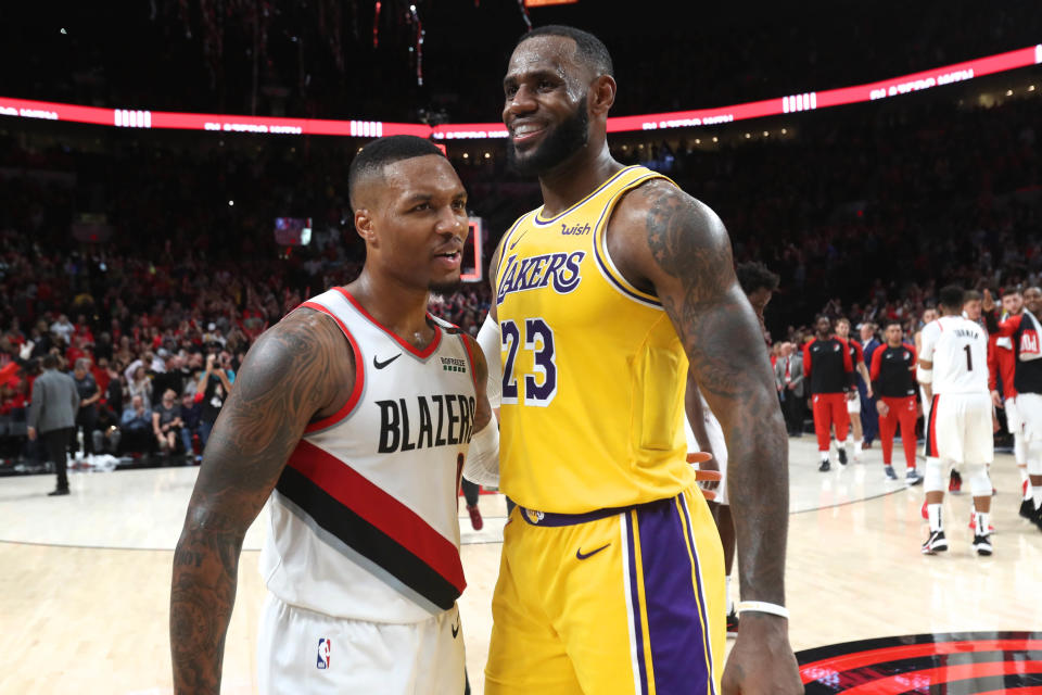 Oct 18, 2018; Portland, OR, USA;  Portland Trail Blazers guard Damian Lillard (0) and Los Angeles Lakers forward LeBron James (23) hug after their game at Moda Center. Mandatory Credit: Jaime Valdez-USA TODAY Sports