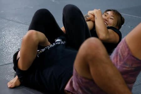 MMA fighter Angela Lee trains with her brother Christian Lee in Singapore May 18, 2017. REUTERS/Yong Teck Lim