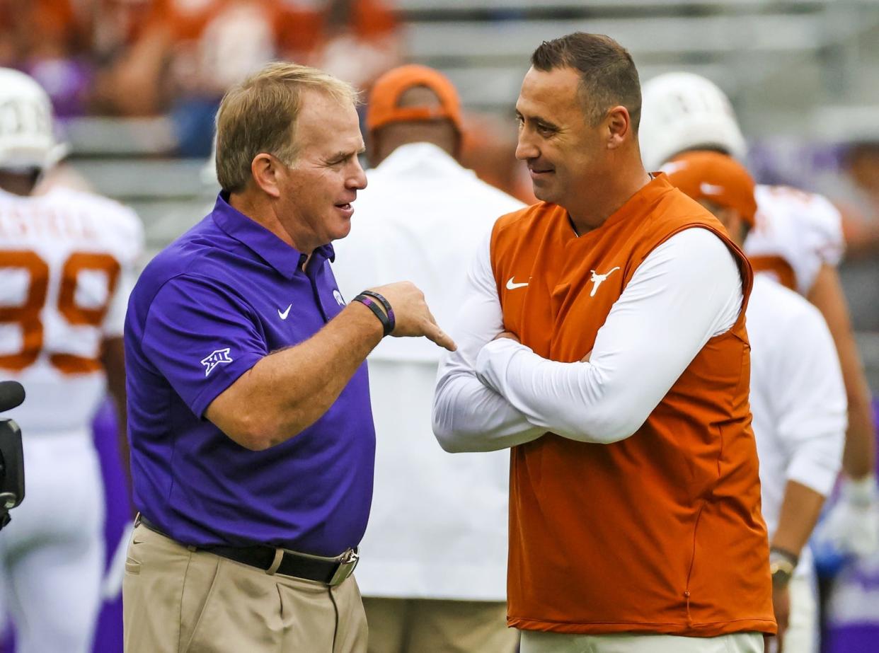 Texas coach Steve Sarkisian, right, hired former TCU coach Gary Patterson, left, to become a special assistant with the Longhorns in January. By NCAA rules, Patterson can't be an on-field coach. But he can play an important behind-the-scenes role in prepping the team's defense, scouting and game planning.