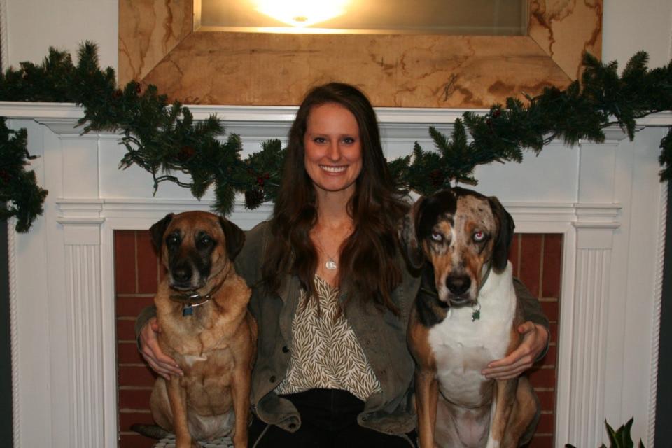 Veterinarian Cait Moreland plans to open Belmont Animal Hospital on South Point Road in early summer 2023. Here she is pictured with her dogs, Jelly Belly (brown) and Tetra (multi-colored).