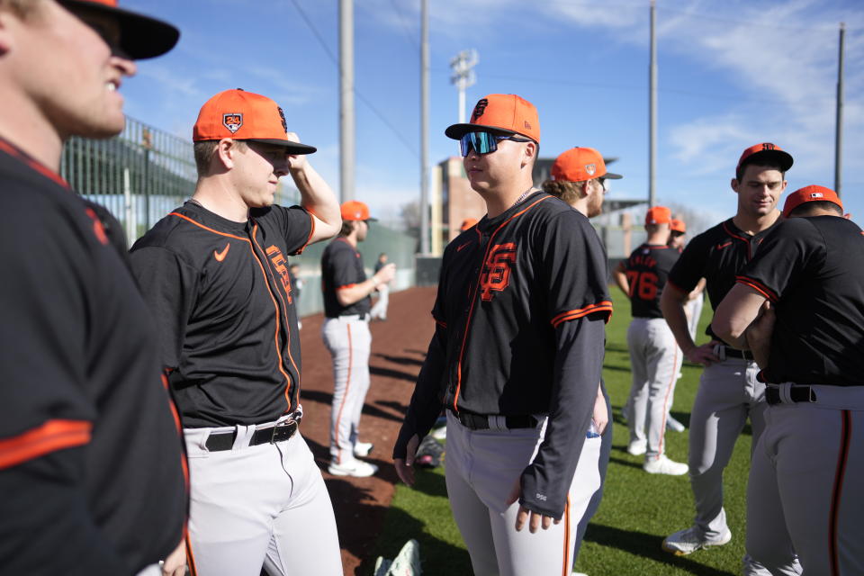 SCOTTSDALE, ARIZONA - FEBRUARY 15: Kyle Harrison (45) and Kai-Wei Teng (70) of the San Francisco Giants prepare for the workout at Scottsdale Stadium on February 15, 2024 in Scottsdale, Arizona. (Photo by Andy Kuno/San Francisco Giants/Getty Images)