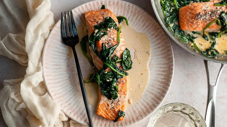 salmon florentine on plate with sauce