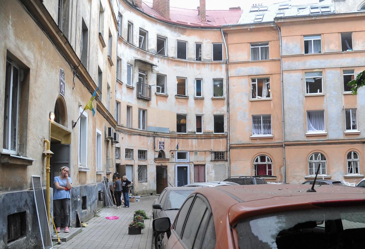 A local woman stands at the site (EPA)