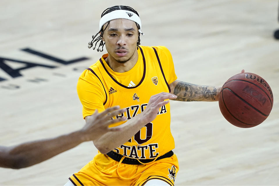 Arizona State guard Jaelen House (10) looks to pass against Oregon State during the second half of an NCAA college basketball game, Sunday, Feb. 14, 2021, in Tempe, Ariz.(AP Photo/Matt York)