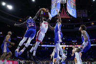 Houston Rockets' Jeff Green (32) goes up for a shot against Philadelphia 76ers' Joel Embiid (21) and Patrick Beverley (22) during the first half of an NBA basketball game, Monday, Jan. 15, 2024, in Philadelphia. (AP Photo/Matt Slocum)