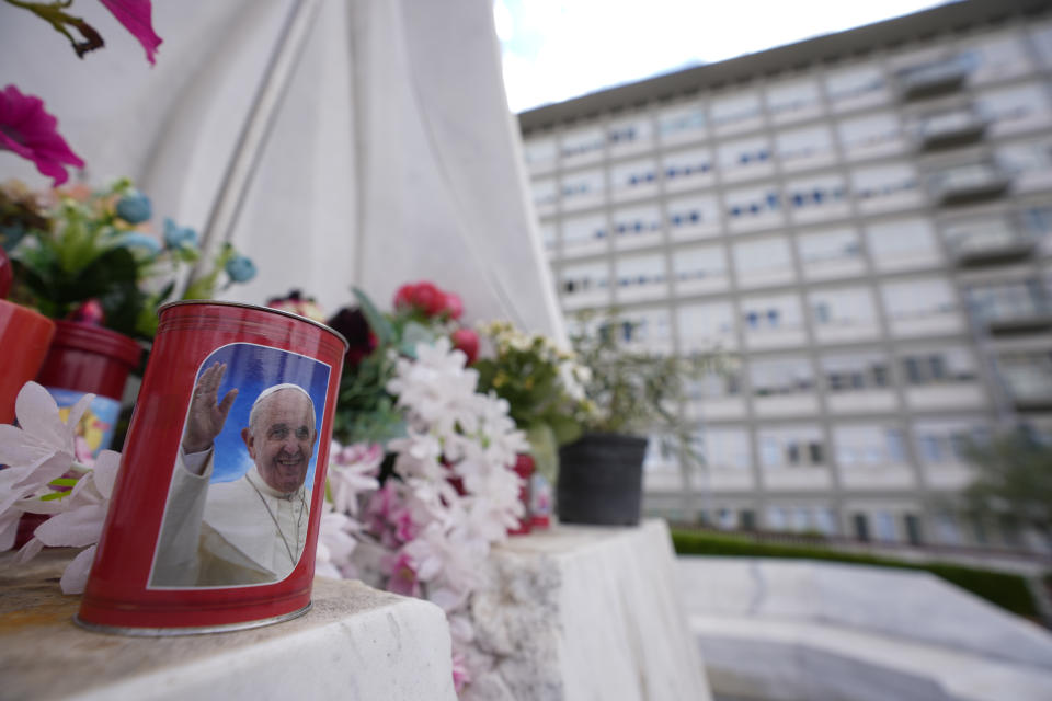 A candle with the image of Pope Francis is left in front of the windows of the Agostino Gemelli University Polyclinic in Rome, Sunday, June 11, 2023, where Pope Francis is recovering from the abdominal surgery he underwent on Wednesday. Pope Francis, following doctors' advice, skipped Sunday's customary public blessing to allow him to better heal after abdominal surgery. (AP Photo/Andrew Medichini)