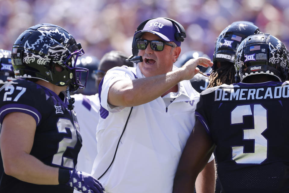 FILE - TCU head coach Sonny Dykes celebrates with his players after TCU scored a touchdown against Oklahoma during the first half of an NCAA college football game Saturday, Oct. 1, 2022, in Fort Worth, Texas. TCU won 55-24. TCU's Sonny Dykes won The Associated Press Coach of the Year on Monday, Dec. 19, after leading the No. 3 Horned Frogs to the College Football Playoff in his first season with the school. (AP Photo/Ron Jenkins, File)