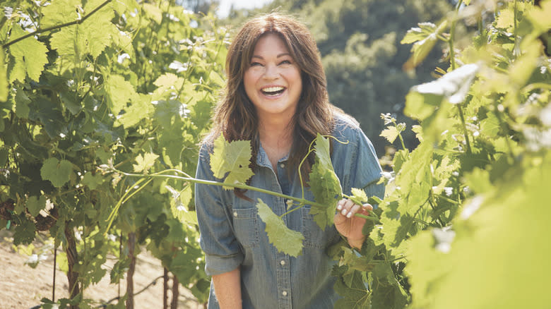 Valerie Bertinelli holding stem with leaves