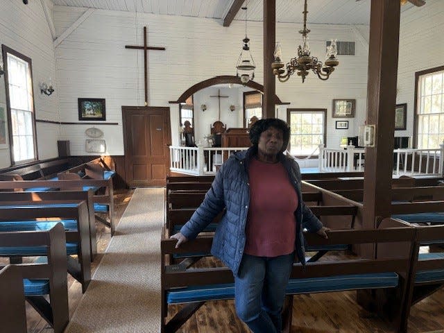 Sallie Robinson stands in the First Union African Church that her father helped build in Daufuskie Island, SC.