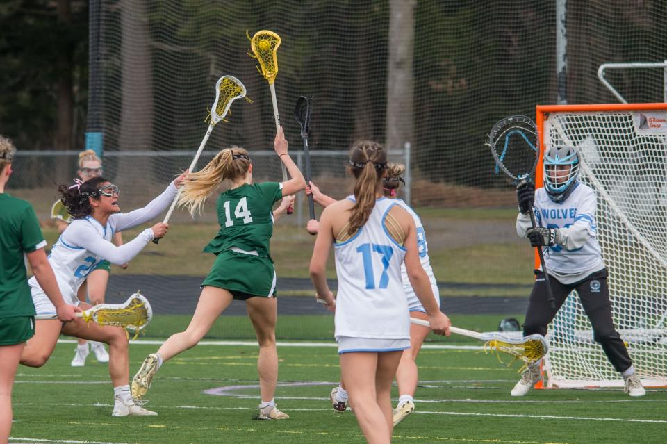 Rice's Sophie Roberts moves in for a shot on goal during the Green Knights' 13-5 loss to the South Burlington Wolves on Thursday afternoon in South Burlington.