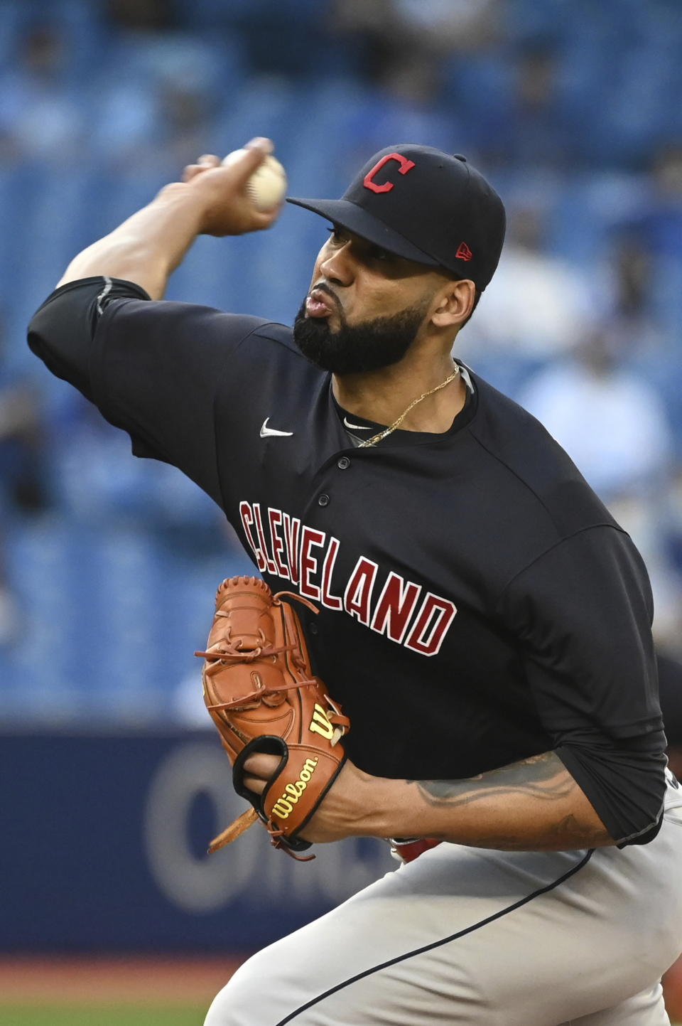 Cleveland Indians' J. C. Mejia pitches against the Toronto Blue Jays during the first inning of a baseball game Wednesday, Aug. 4, 2021, in Toronto. (Jon Blacker/The Canadian Press via AP)