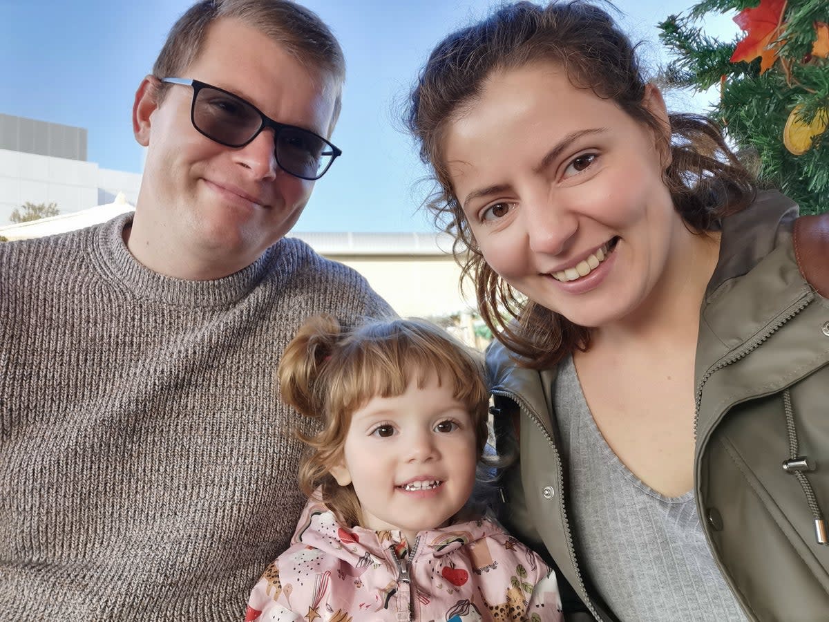 Alicja Banks (right, with her husband) said sending her daughter (centre) to nursery for four days a week would have cost up to £1,120 a month (Alicja Banks)