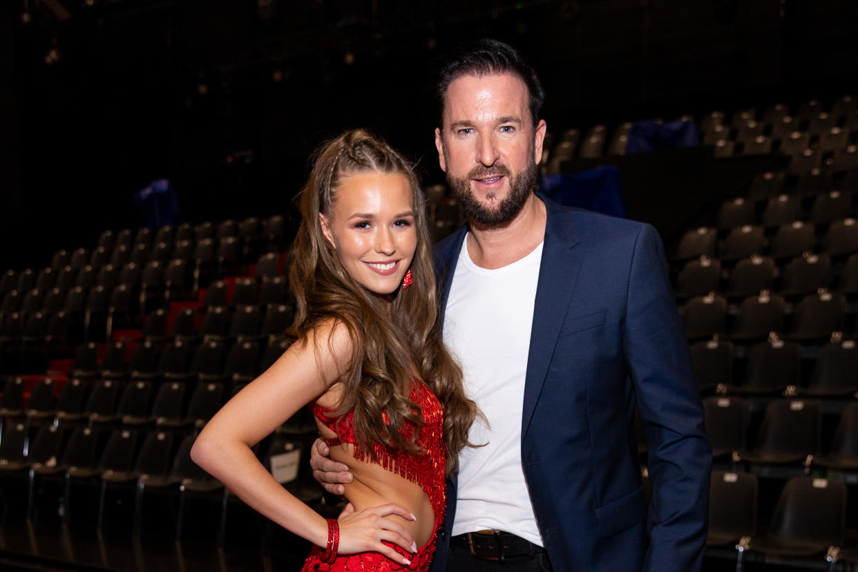 COLOGNE, GERMANY - FEBRUARY 21:  Michael Wendler and Laura Mueller pose on stage during the pre-show 