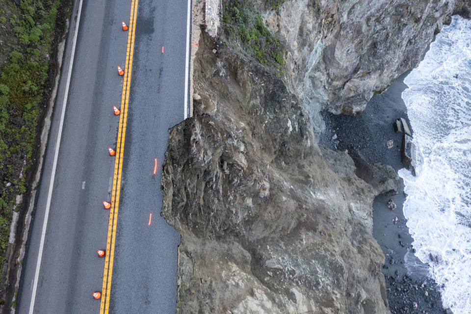 Cones mark a break in the southbound lane of Highway 1 at Rocky Creek Bridge in Big Sur, Calif., Monday, April 1, 2024, following an Easter weekend storm. (AP Photo/Nic Coury)
