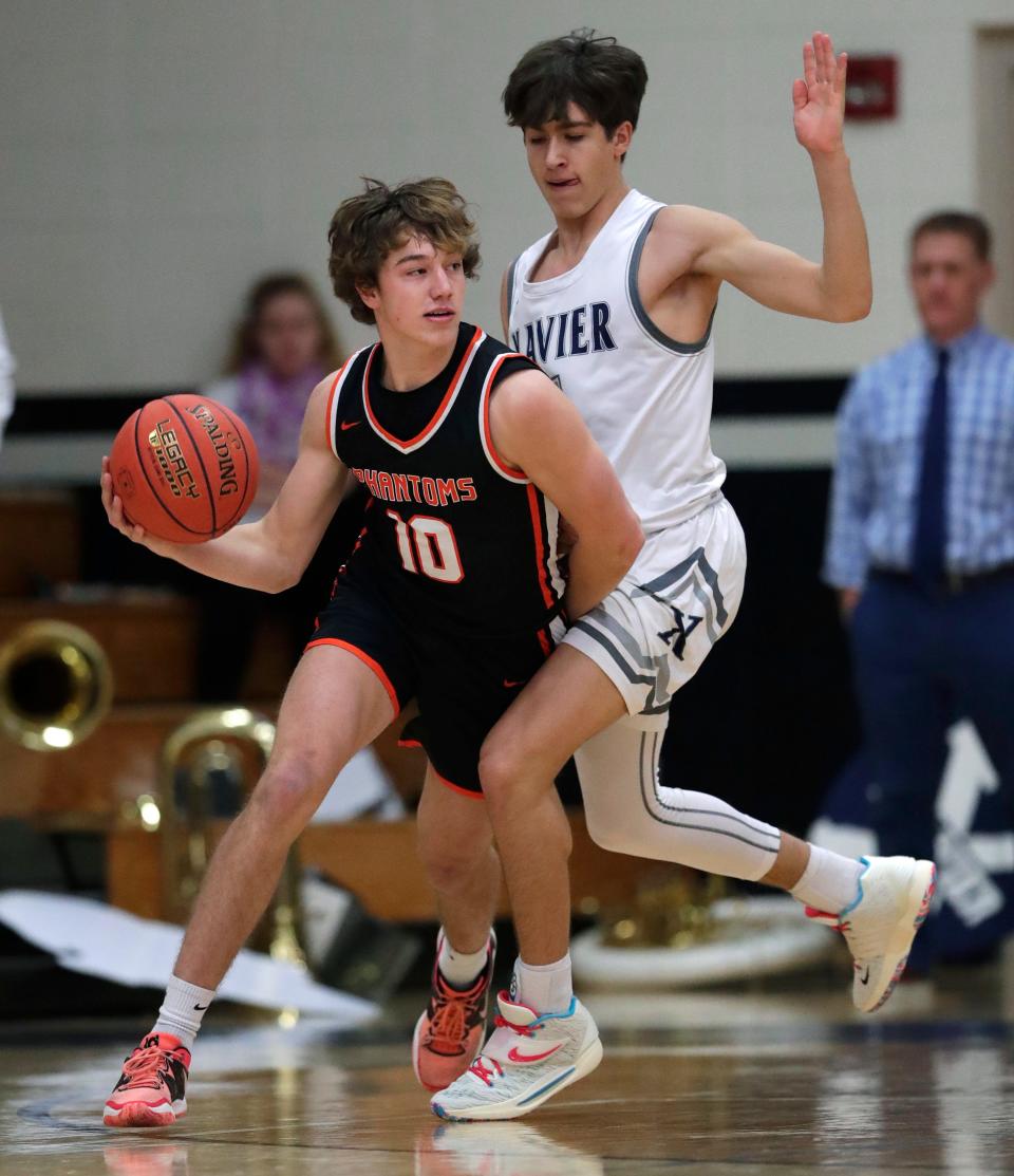 Xavier's Sam Pfefferle, right, is one of the top point guards in the area.