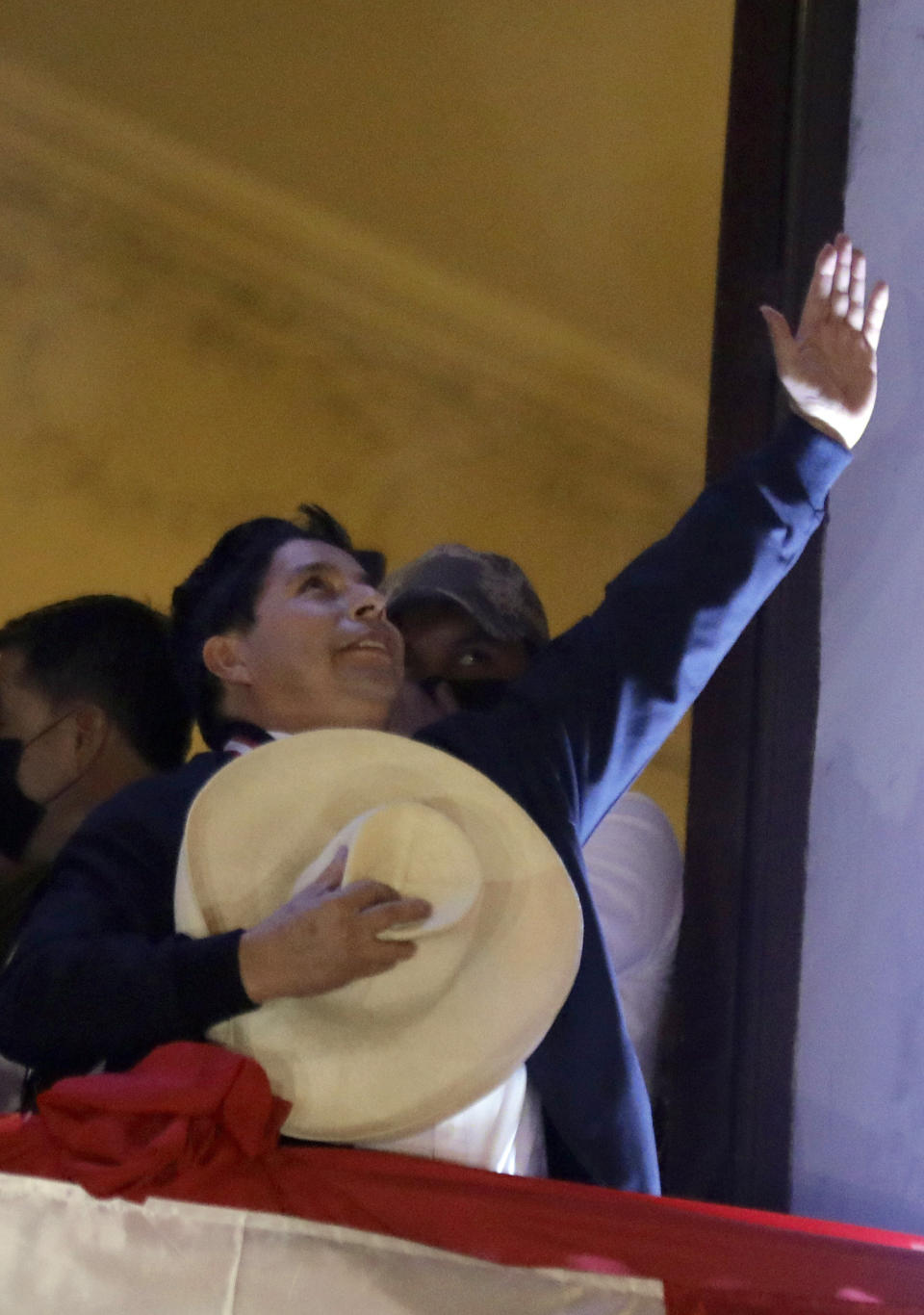 Pedro Castillo celebrates after being declared president-elect by election authorities, at his campaign headquarters in Lima, Peru, Monday, July 19, 2021. Castillo was declared president more than a month after elections took place and after opponent Keiko Fujimori claimed that the election was tainted by fraud. (AP Photo/Guadalupe Prado)