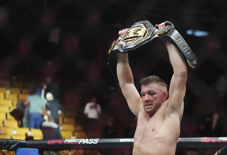 Dricus Du Plessis celebrates after defeating Sean Strickland in a middleweight title bout during the UFC 297 mixed martial arts event in Toronto early Sunday, Jan. 21, 2024. (Nathan Denette/The Canadian Press via AP)