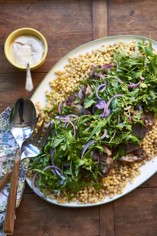 <p>Katie Workman</p><p>A tangle of fresh greens plays so beautifully against rich lamb. This would be great served over couscous.</p><p><strong>Get the recipe: <a href="https://themom100.com/recipe/slow-cooked-herbed-leg-lamb-fresh-herb-arugula-salad/" rel="nofollow noopener" target="_blank" data-ylk="slk:Slow Cooked Herbed Leg of Lamb with Fresh Herb and Arugula Salad;elm:context_link;itc:0;sec:content-canvas" class="link ">Slow Cooked Herbed Leg of Lamb with Fresh Herb and Arugula Salad</a></strong></p>