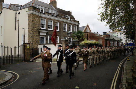 Military personnel march during a Remembrance Sunday parade through Fulham in West London, Britain November 8, 2015. REUTERS/Kevin Coombs