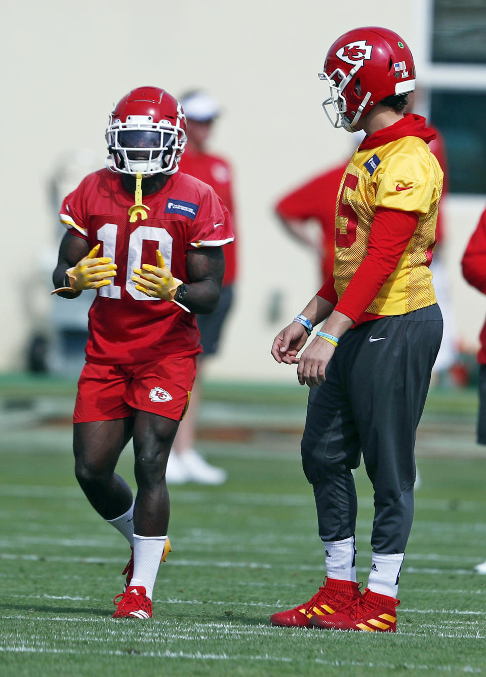 Kansas City Chiefs wide receiver Tyreek Hill (10) talks with quarterback Patrick Mahomes (15) during practice on Friday, Jan. 31, 2020, in Davie, Fla., for the NFL Super Bowl 54 football game. (AP Photo/Brynn Anderson)